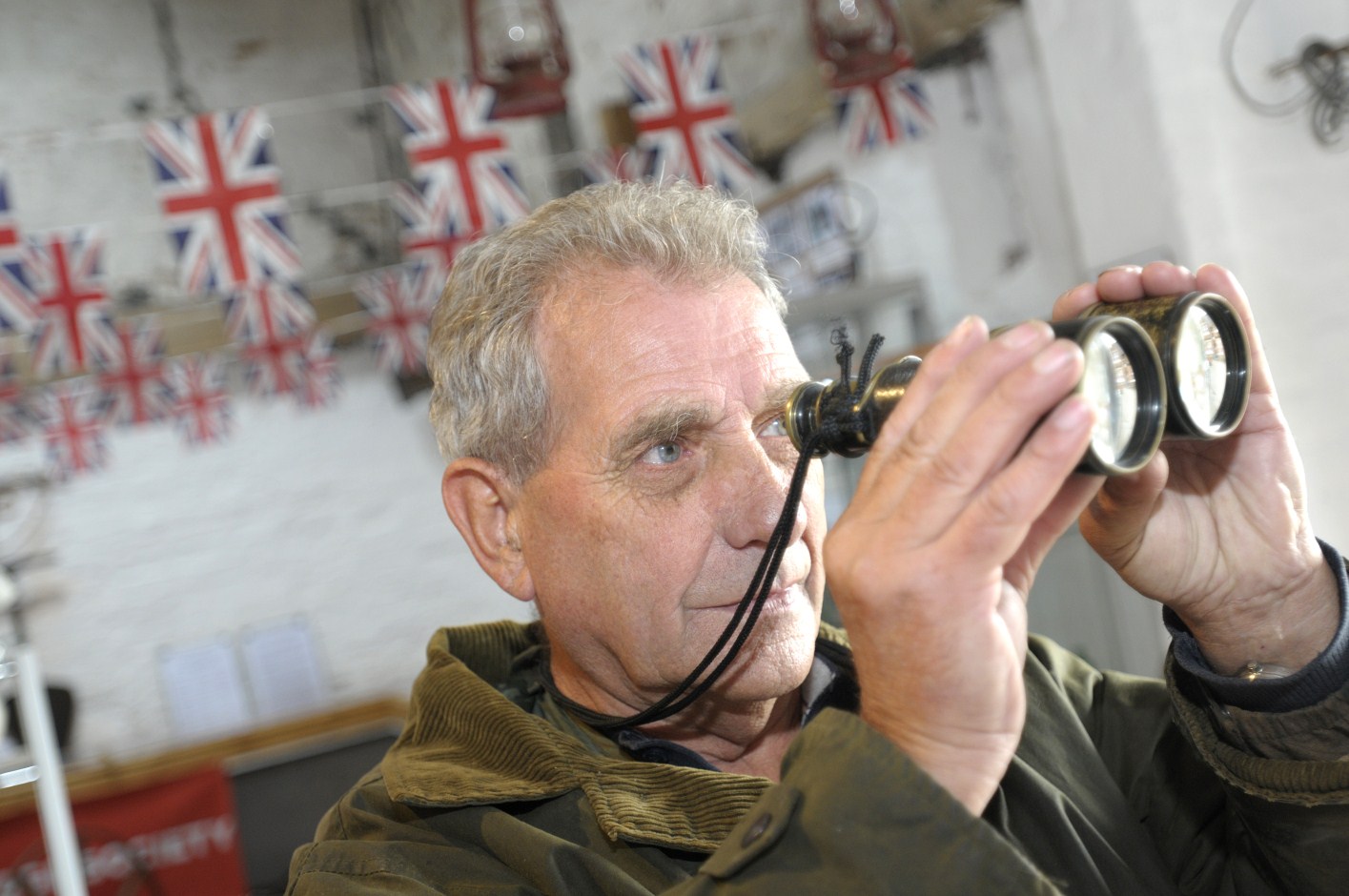 <b>Ray Waring</b> scans the horizon with WW1 binoculars - 3024277