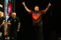 Michael Smith throws a nine-darter in Premier League win