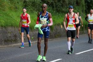 Matt Crehan races alongside Sir Mo Farah in Antrim half marathon