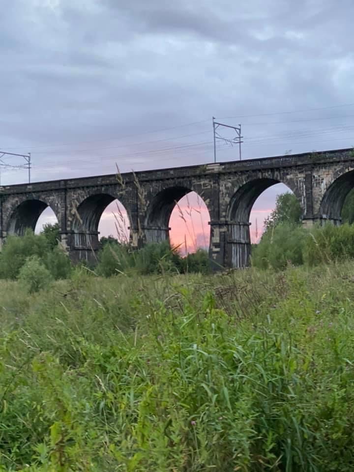 Nine Arches along Sankey Canal with the sun setting behind