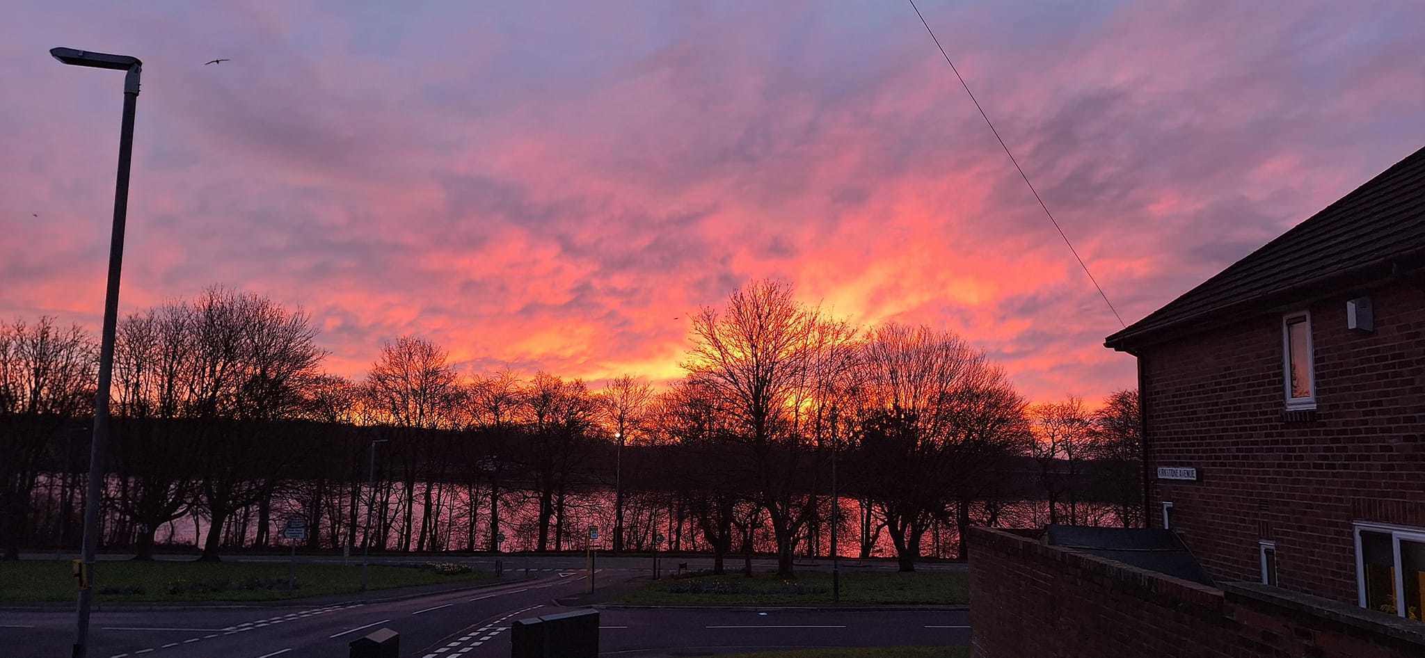 Sunrise over Carr Mill Dam by Karen ODowd