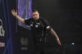 Michael Smith throws 14 180s on his way to third round