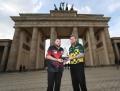 12,000 Berlin crowd will see Michael Smith's top of the table Premier League clash