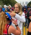 Colette Flaherty runs Chicago Marathon and receives medal from Paula Radcliffe